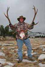 Elk antlers, happy hunter